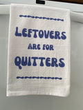 White kitchen towel with Leftovers Are for Quitters in bold blue bubble lettering